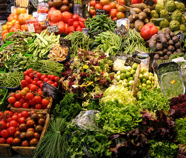 a colorful array of fruits and vegetableson display at a market