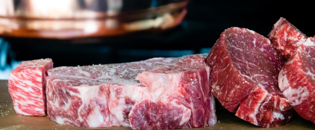 raw meat on wood