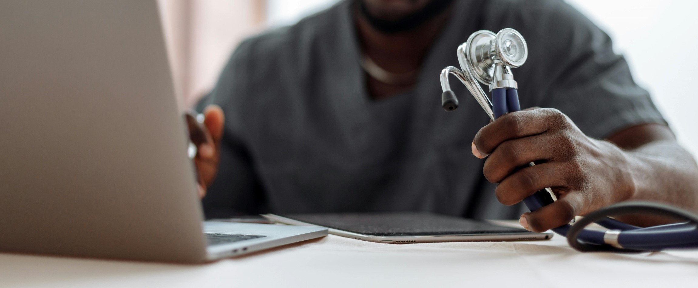 close-up of hand holding stethoscope