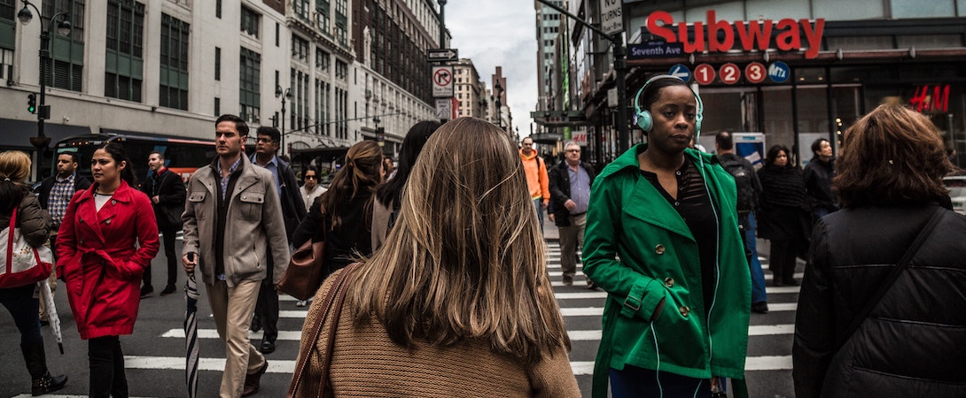 people walking through crosswalk