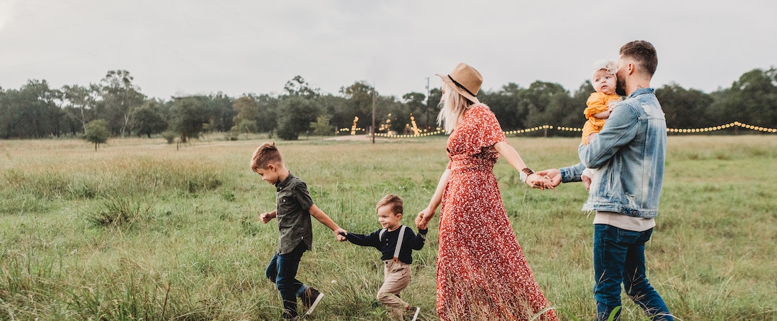 family walking in a field
