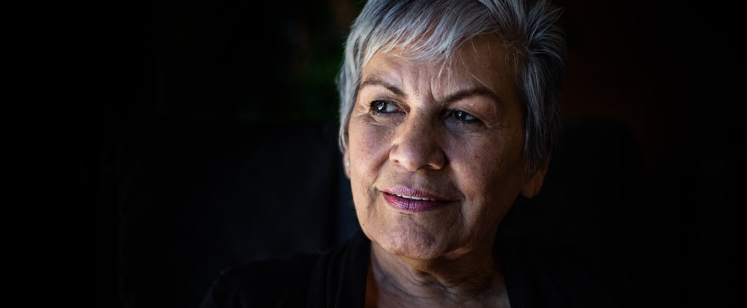 older woman black background