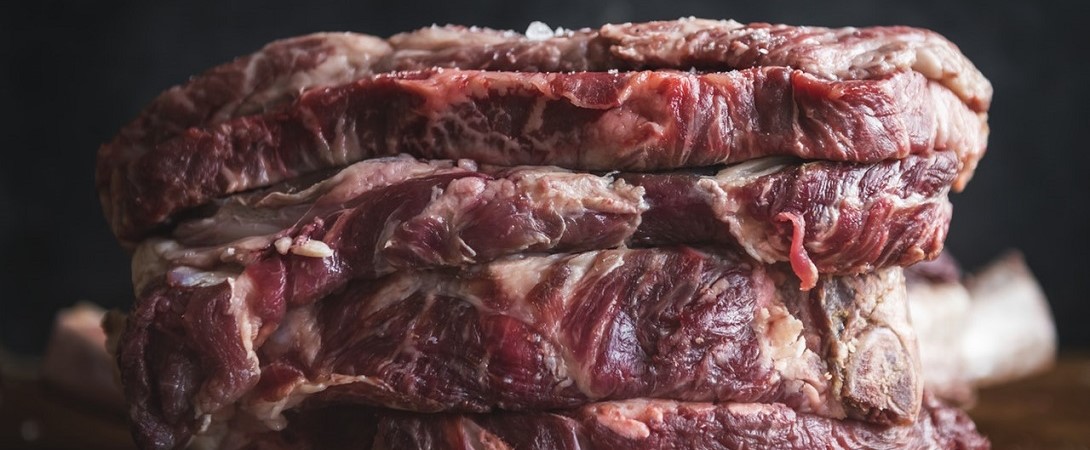 slabs of raw meat stacked on top of each other