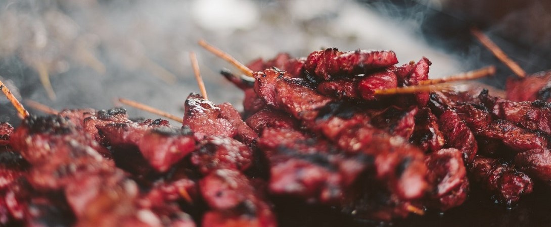cooked, red poultry on sticks