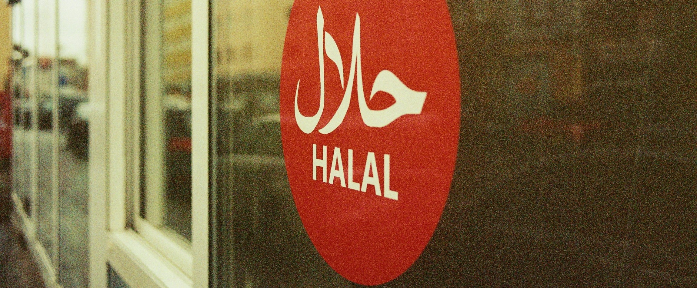 red halal sign in window